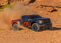 [Action] Traxxas Raptor R - arazide toz kaldıran siyah-turuncu RC pickup