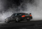 [Action] Traxxas 4-Tec 240SX - siyah araç drift dumanı içinde arka çeyrek