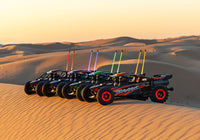 [Action] Traxxas Funco Sand Car - dört renk kumda dizili gün batımı