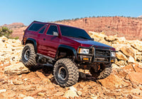 [Action] Traxxas TRX-4 Pathfinder - kırmızı araç kırmızı kaya arazisinde taşlı zeminde
