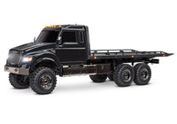 [Dış] Traxxas TRX-6 Hauler - stüdyo çekimi 3/4 önden, siyah tam araç beyaz fonda